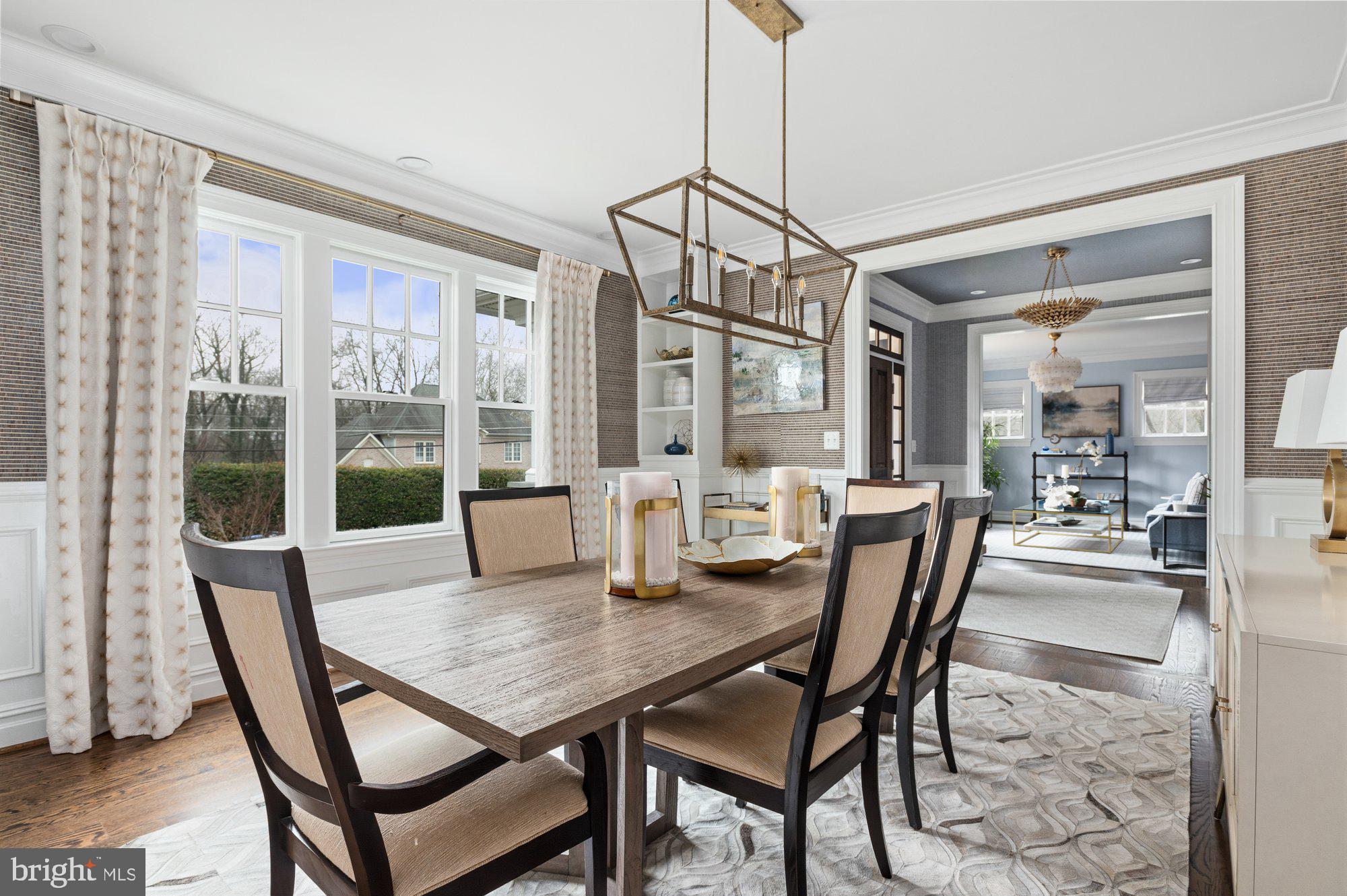 1610 Brookside Road McLean, VA 22101 - Photo 6 of 51 a view of a dining room and livingroom with furniture wooden floor a chandelier