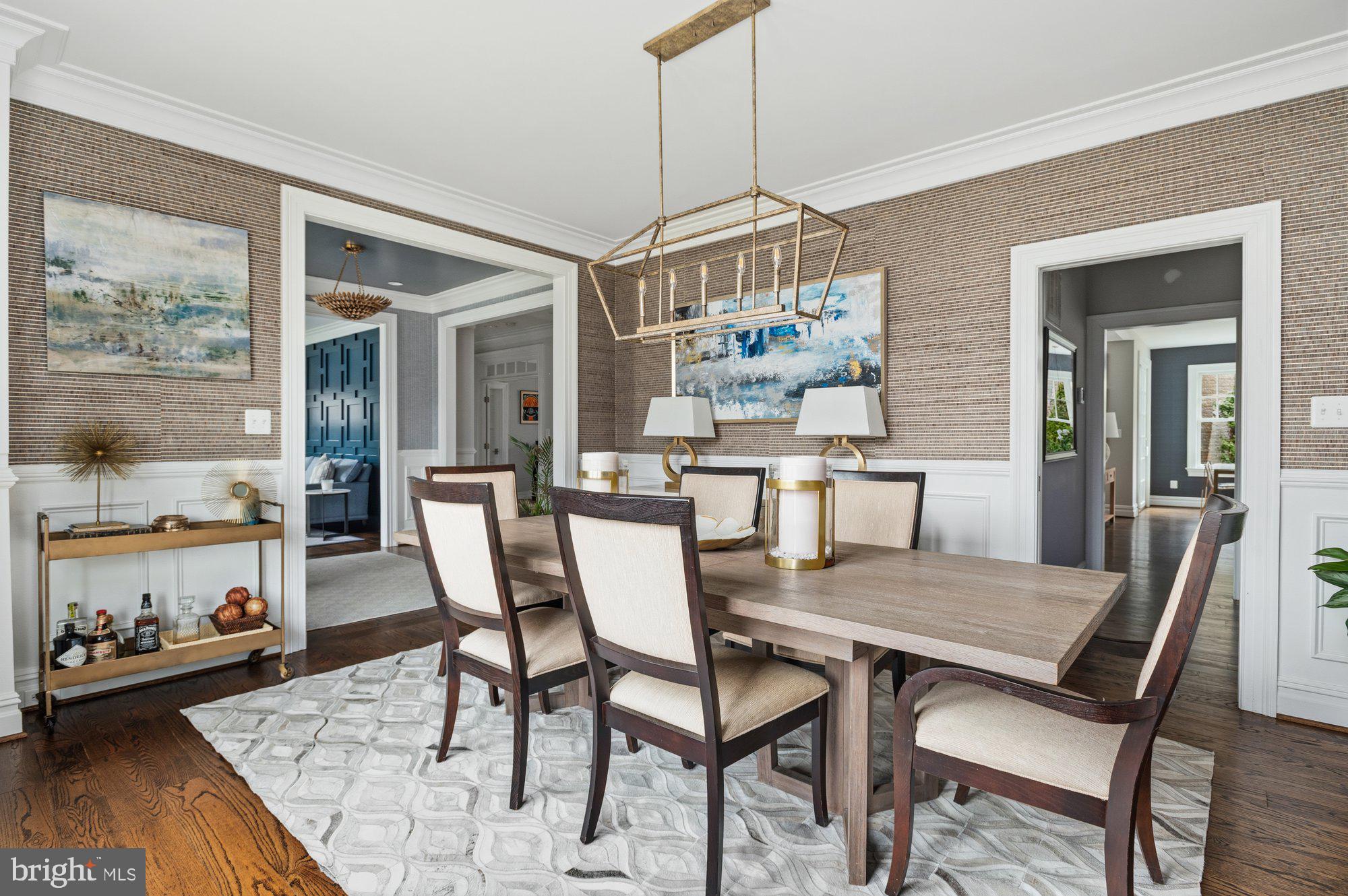 1610 Brookside Road McLean, VA 22101 - Photo 7 of 51 a dining room with furniture a chandelier and wooden floor