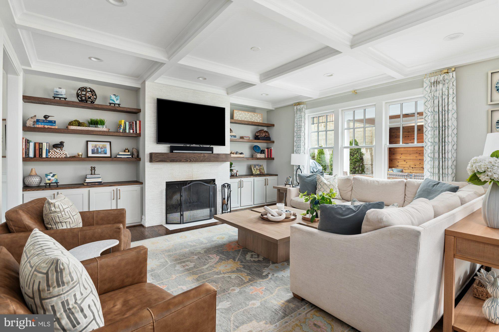 1610 Brookside Road McLean, VA 22101 - Photo 10 of 51 a living room with furniture a flat screen tv and a fireplace
