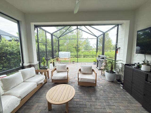 19696 Weathervane Way Loxahatchee, FL 33470 - Photo 19 of 39 a living room with furniture and a large window
