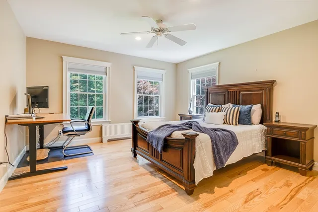 a bedroom with a bed and a lamp on table