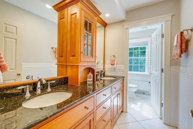 a kitchen with granite countertop cabinets and window
