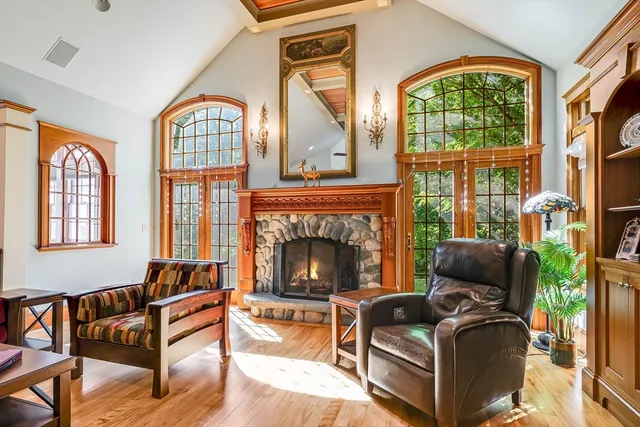 a living room with furniture fireplace and flat screen tv