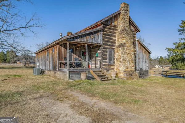 a view of large house with a yard