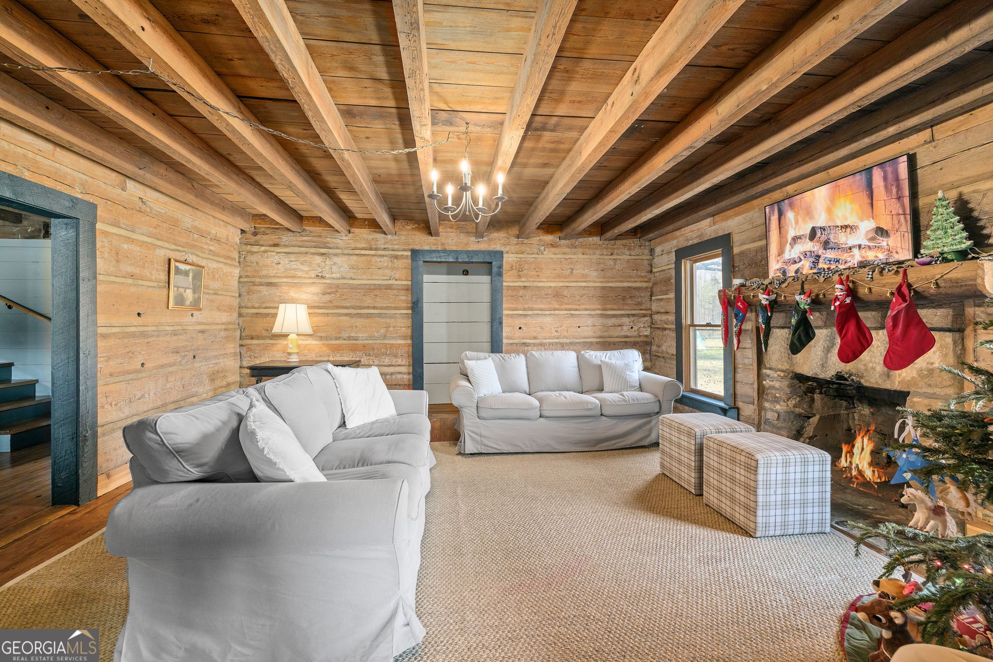 28 Ayersville Road Toccoa, GA 30577 - Photo 6 of 29 a living room with furniture and a chandelier