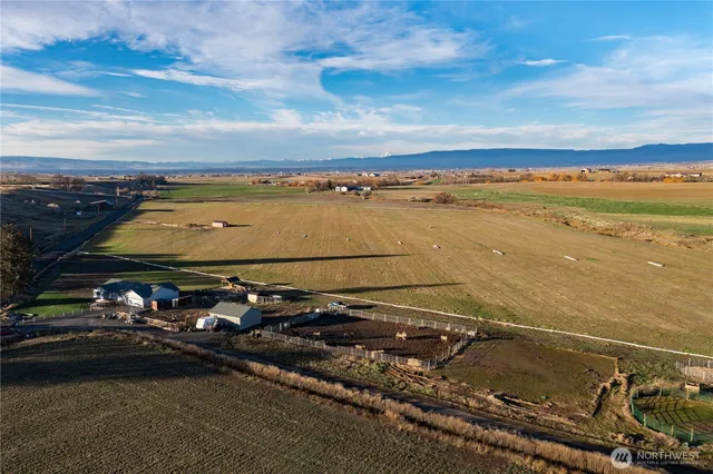a view of a swimming pool with an outdoor seating area