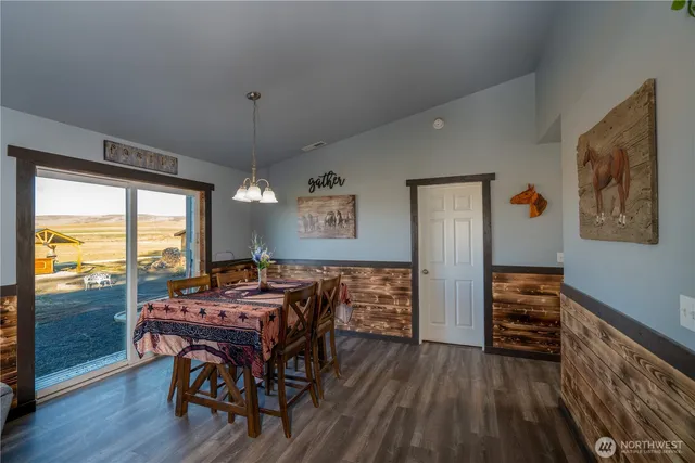 a view of a dining room with furniture window and wooden floor