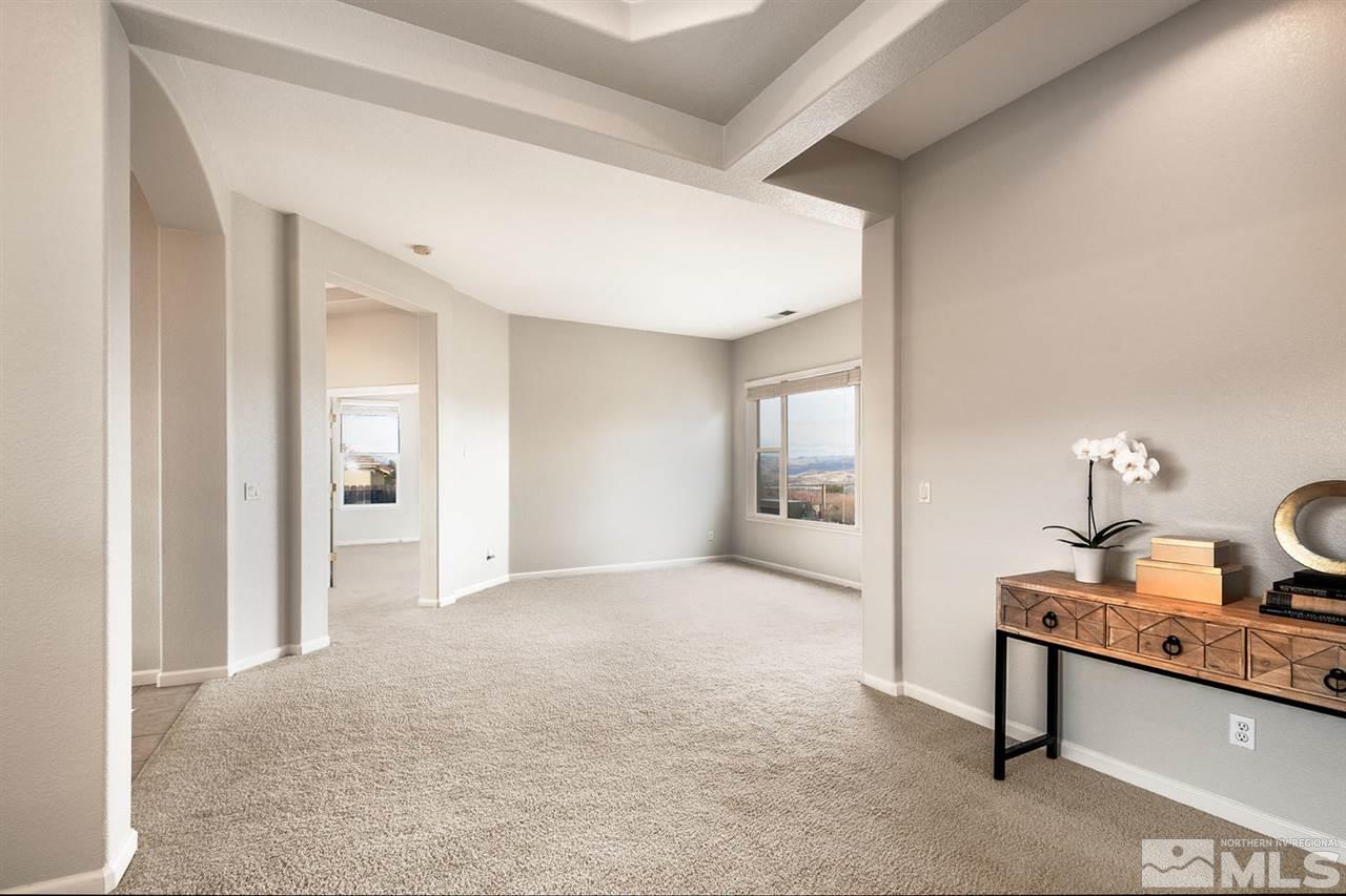 5665 North White Sands Road Reno, NV 89511 - Photo 8 of 25 a view of a livingroom with a furniture and window
