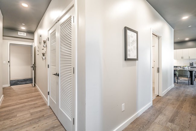 50 Music Square West, Unit 114 Nashville, TN 37203 - Photo 16 of 83 a view of a hallway with wooden floor