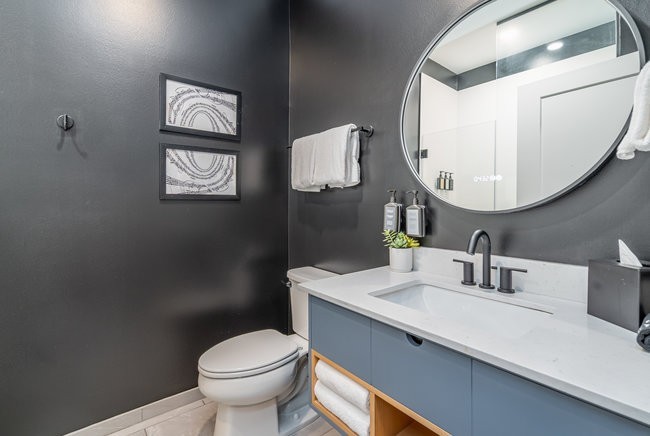 50 Music Square West, Unit 114 Nashville, TN 37203 - Photo 28 of 83 a bathroom with a toilet sink and mirror