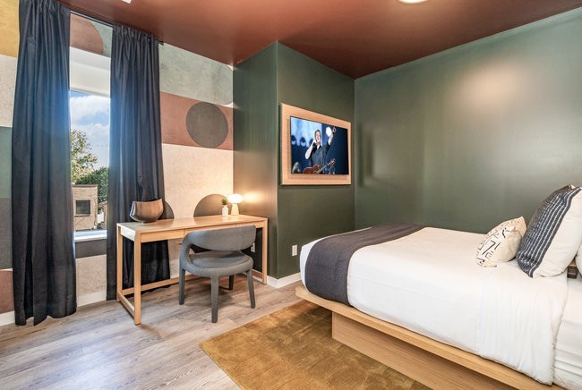 50 Music Square West, Unit 114 Nashville, TN 37203 - Photo 30 of 83 a bedroom with a bed and a window