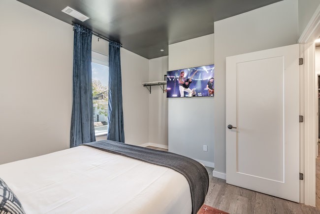 50 Music Square West, Unit 114 Nashville, TN 37203 - Photo 34 of 83 a bedroom with a bed and a window