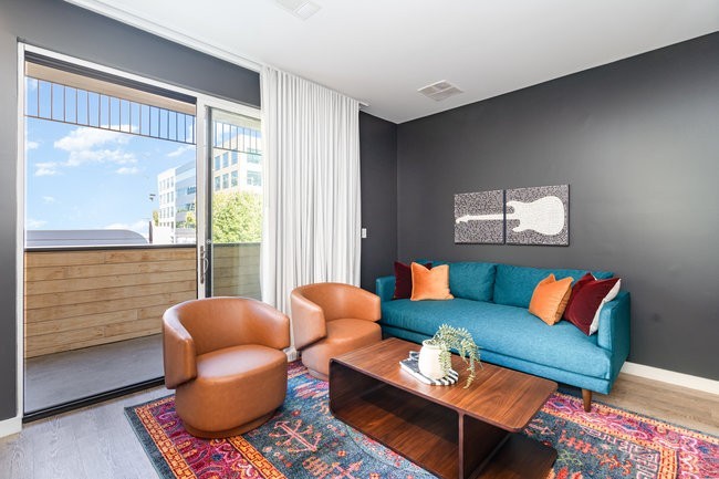50 Music Square West, Unit 114 Nashville, TN 37203 - Photo 39 of 83 a living room with furniture a rug and a large window