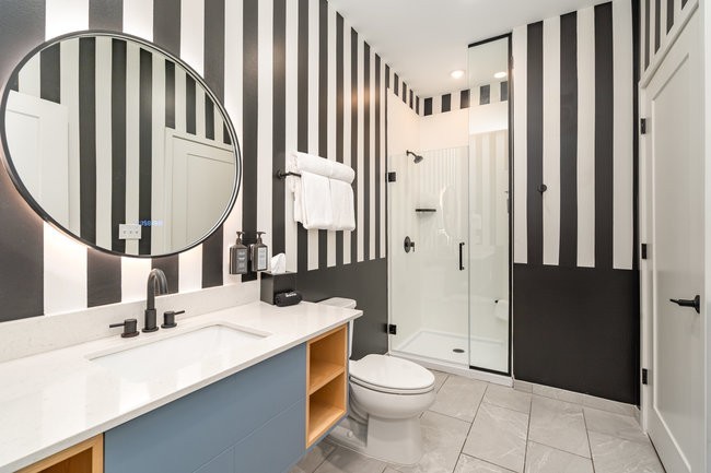 50 Music Square West, Unit 114 Nashville, TN 37203 - Photo 50 of 83 a bathroom with a double vanity sink toilet and shower