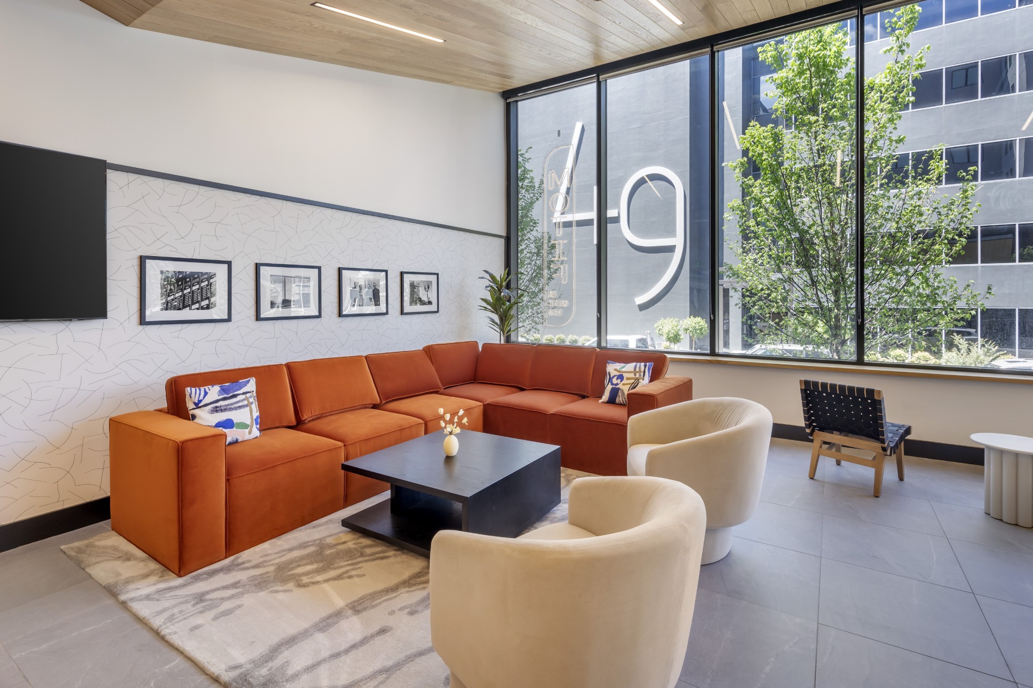 50 Music Square West, Unit 114 Nashville, TN 37203 - Photo 6 of 83 a living room with furniture and a large window