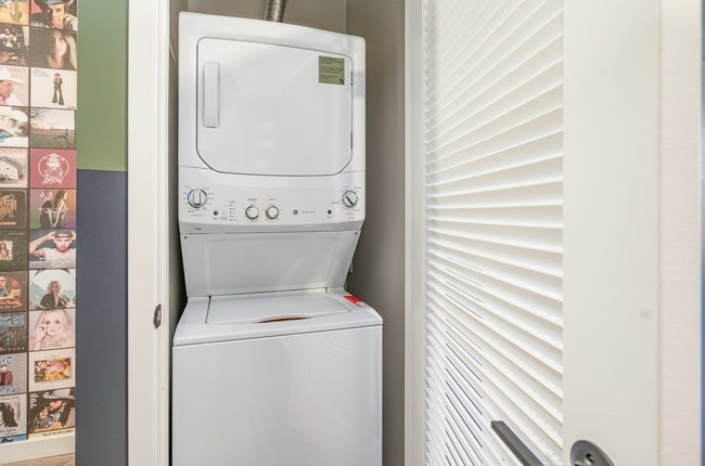 50 Music Square West, Unit 114 Nashville, TN 37203 - Photo 65 of 83 a utility room with dryer and washer