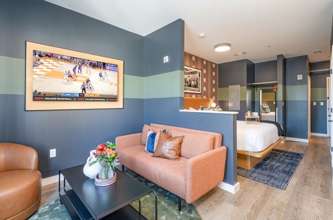 50 Music Square West, Unit 114 Nashville, TN 37203 - Photo 81 of 83 a living room with furniture and a wooden floor