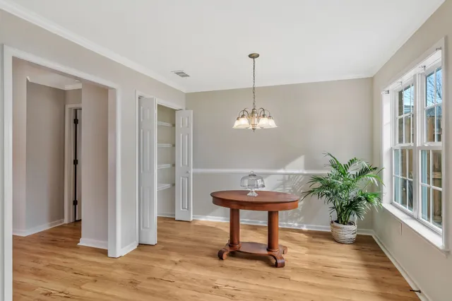 a view of a room with furniture wooden floor and staircase