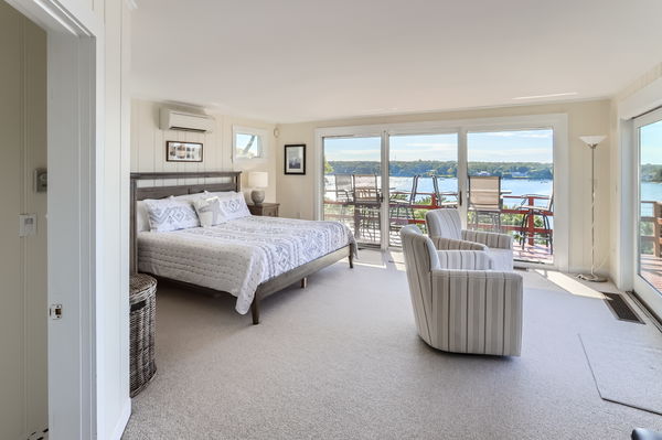 217 Barnes Road Oak Bluffs, MA 02557 - Photo 11 of 60 a bedroom with a bed couch and a large window