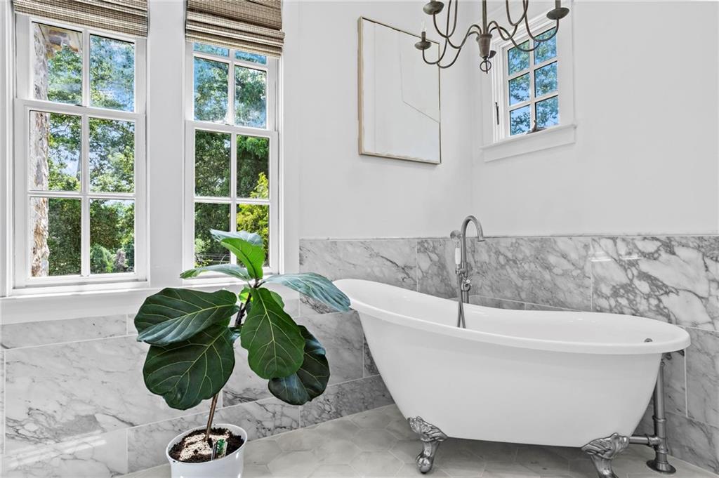 2630 Old Atlanta Road Cumming, GA 30041 - Photo 36 of 87 a white bath tub sitting in a bathroom next to a window
