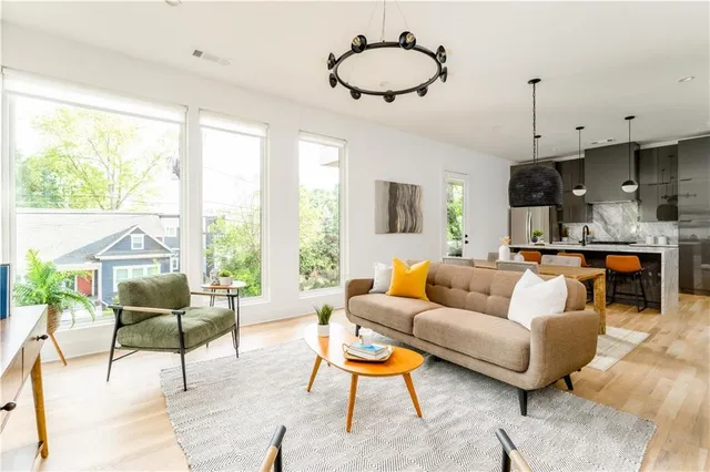 a living room with furniture and a large window