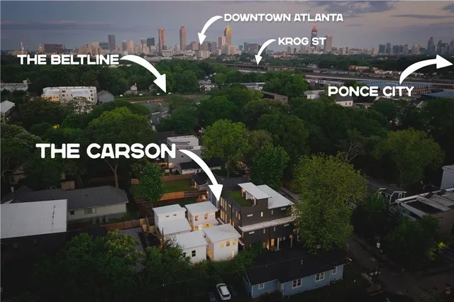 a view of a swimming pool and outdoor seating