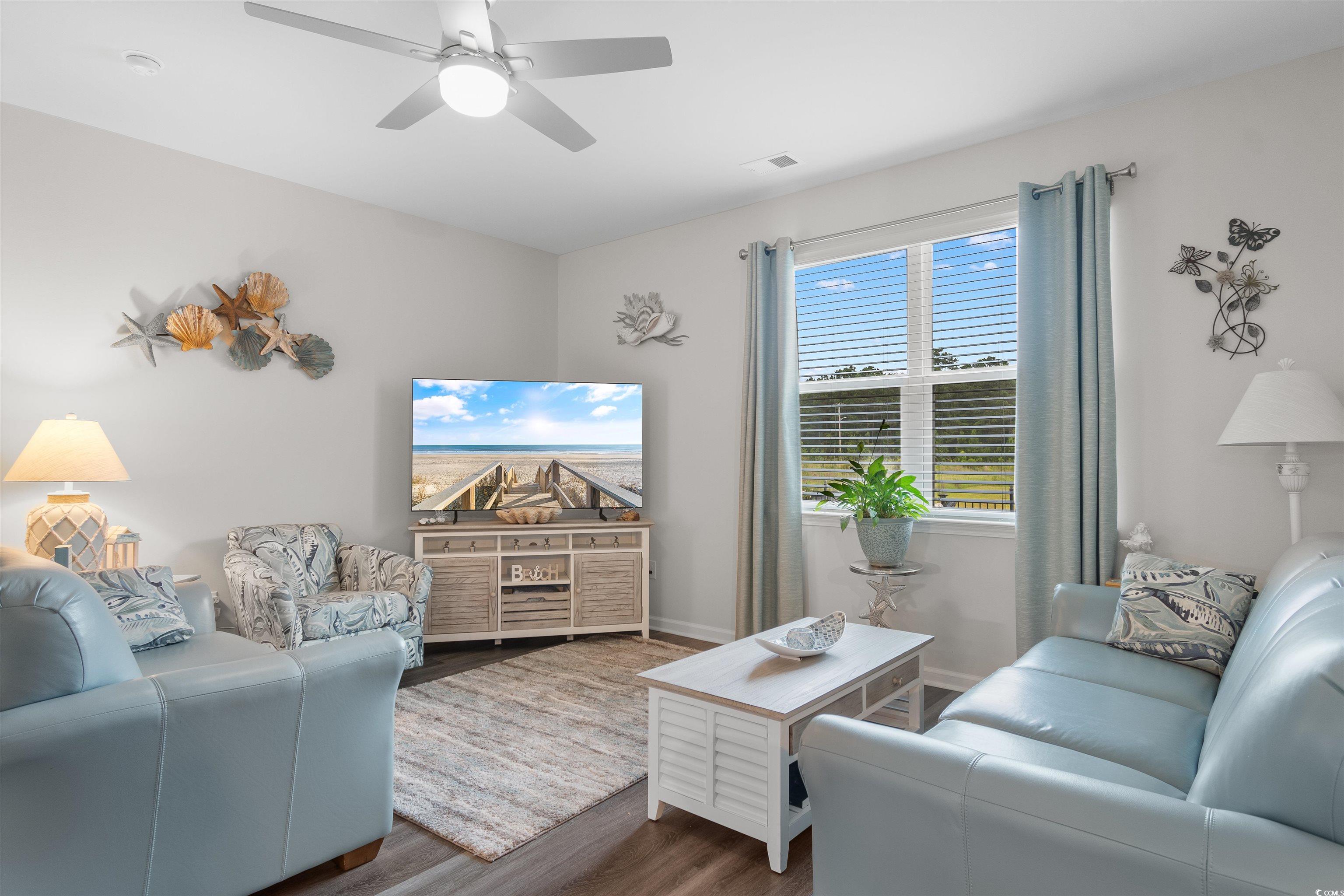 2438 Polaris Path Myrtle Beach, SC 29577 - Photo 13 of 40 Living room featuring wood finished floors and ceiling fan