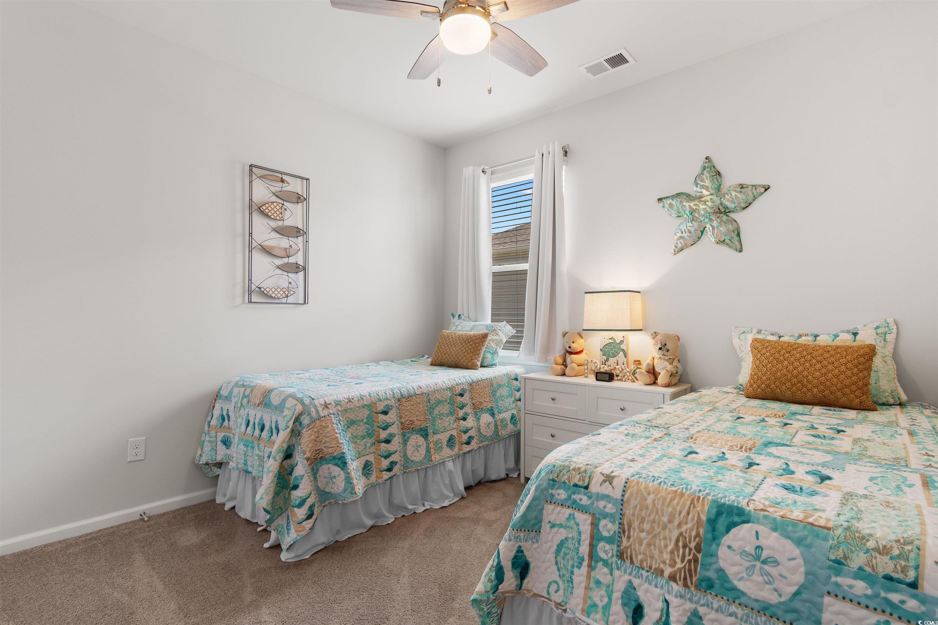 2438 Polaris Path Myrtle Beach, SC 29577 - Photo 18 of 40 Bedroom with light colored carpet and a ceiling fan