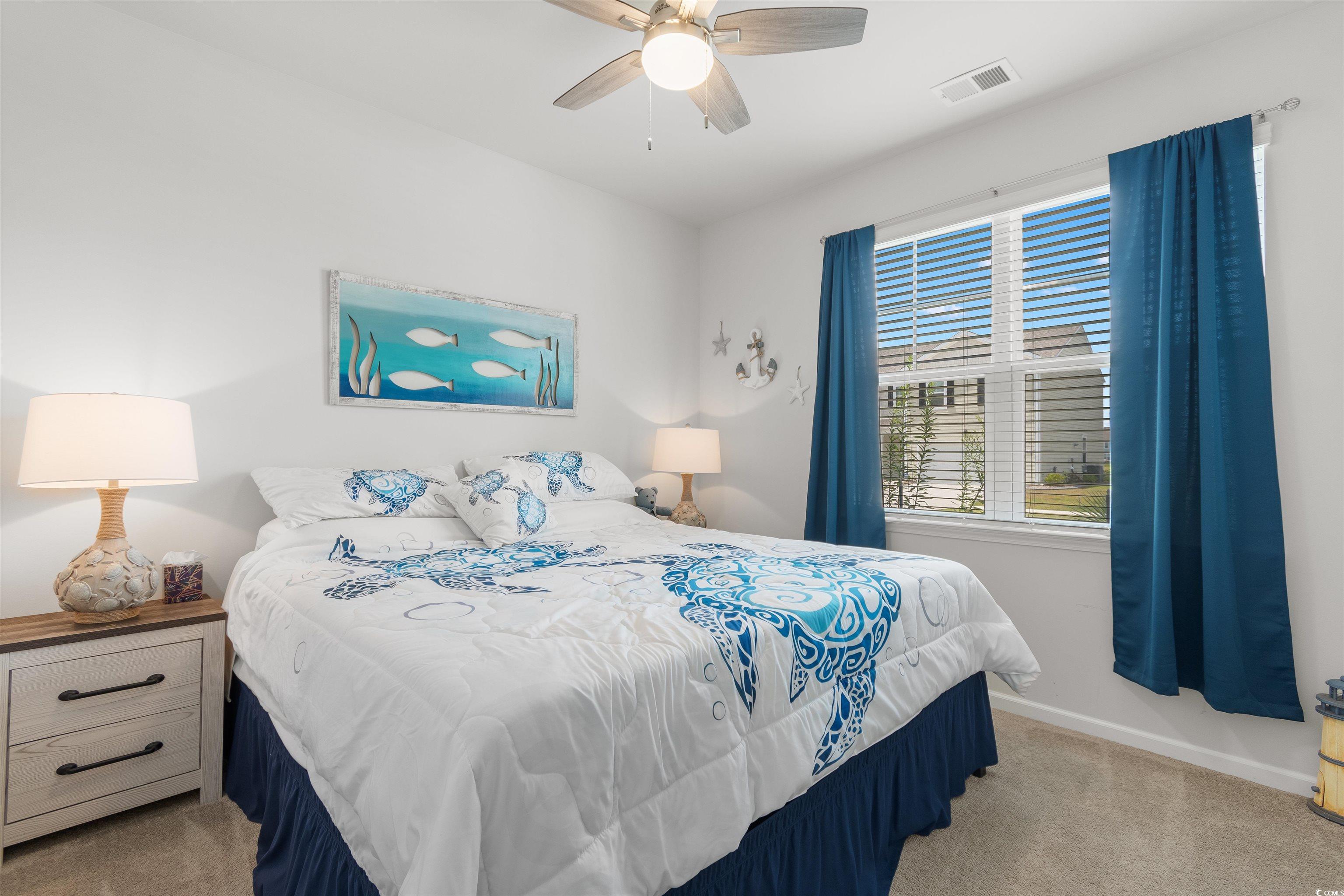 2438 Polaris Path Myrtle Beach, SC 29577 - Photo 20 of 40 Carpeted bedroom with baseboards and ceiling fan