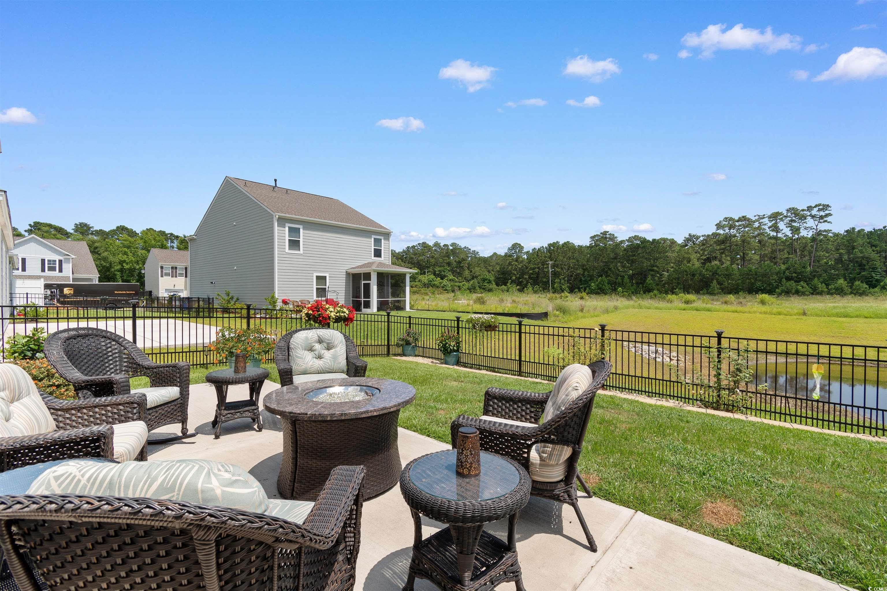 2438 Polaris Path Myrtle Beach, SC 29577 - Photo 26 of 40 Fenced backyard with a patio
