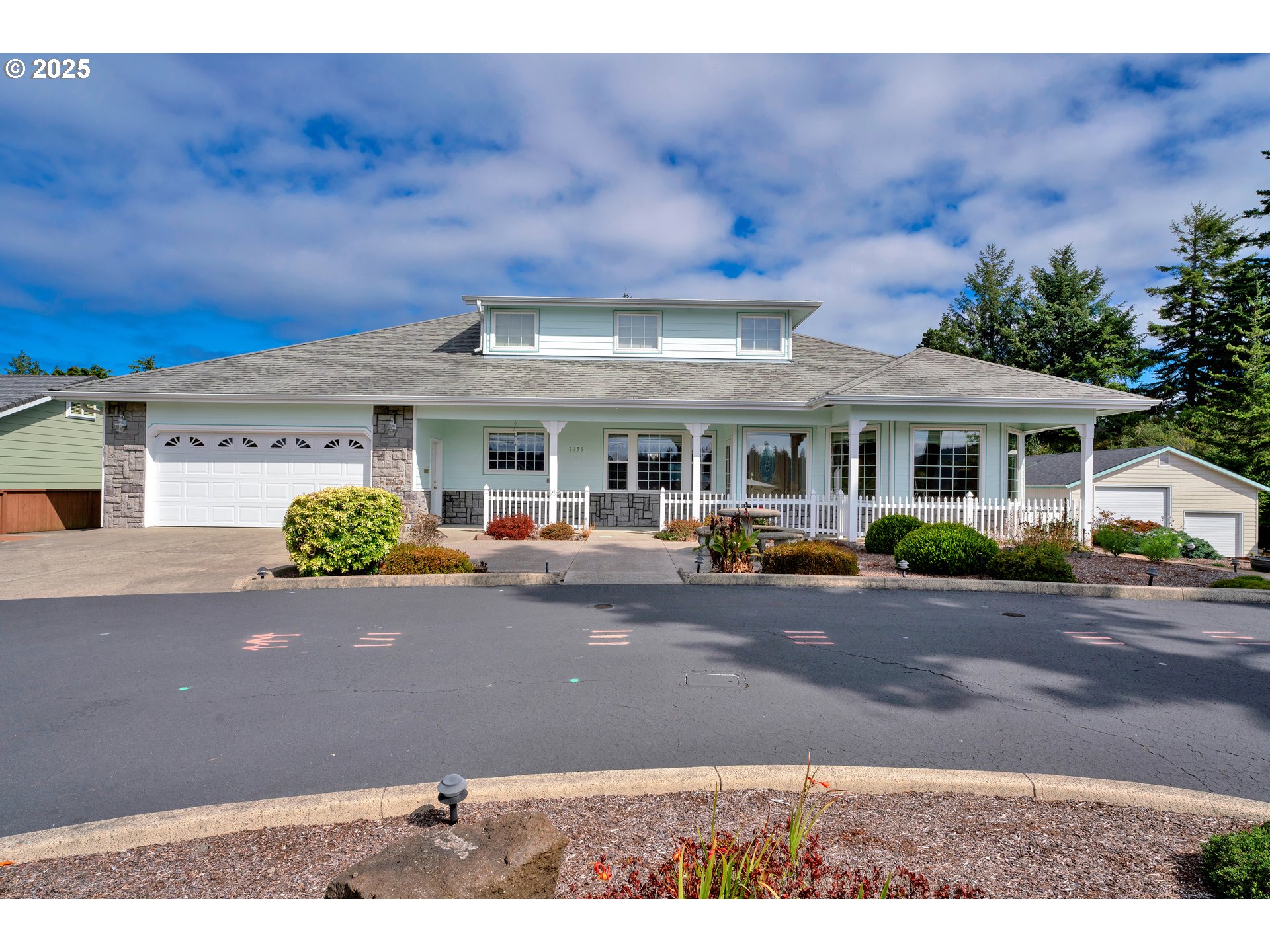 a front view of a house with garden