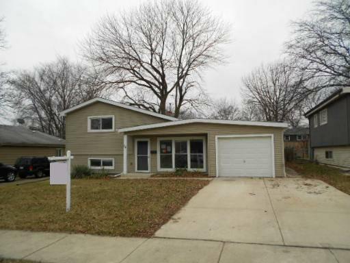 14 Highview Avenue Addison, IL 60101 - Photo 1 of 13 a house with trees in the background