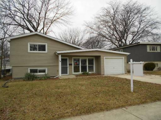 14 Highview Avenue Addison, IL 60101 - Photo 2 of 13 a front view of a house with garden