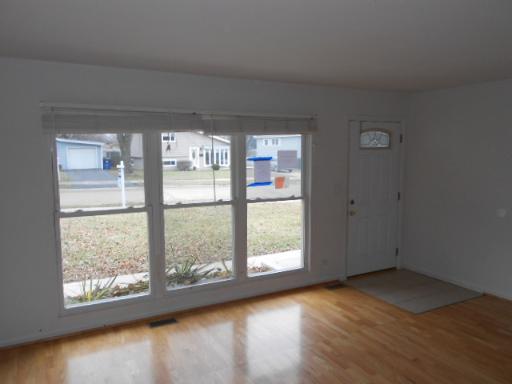 14 Highview Avenue Addison, IL 60101 - Photo 5 of 13 a view of an empty room with wooden floor and a window