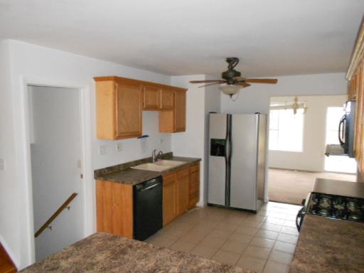 14 Highview Avenue Addison, IL 60101 - Photo 7 of 13 a kitchen with stainless steel appliances granite countertop a sink stove and refrigerator