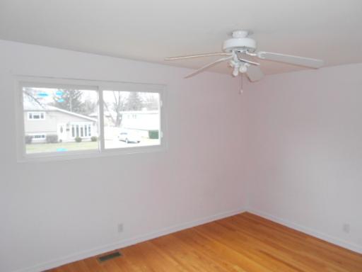 14 Highview Avenue Addison, IL 60101 - Photo 10 of 13 a view of a small space with wooden floor and a window