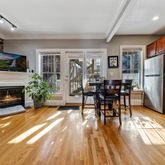 a view of a livingroom with furniture and a fireplace