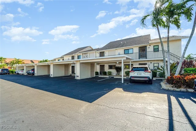 a view of a house with pool porch and sitting area