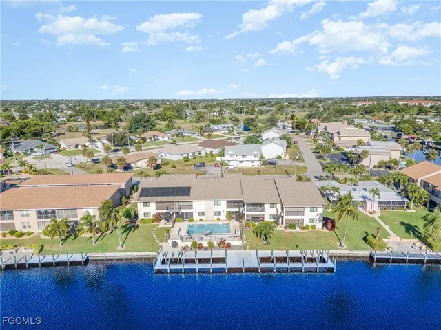 an aerial view of a house with a lake view