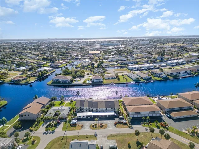 an aerial view of a houses with yard