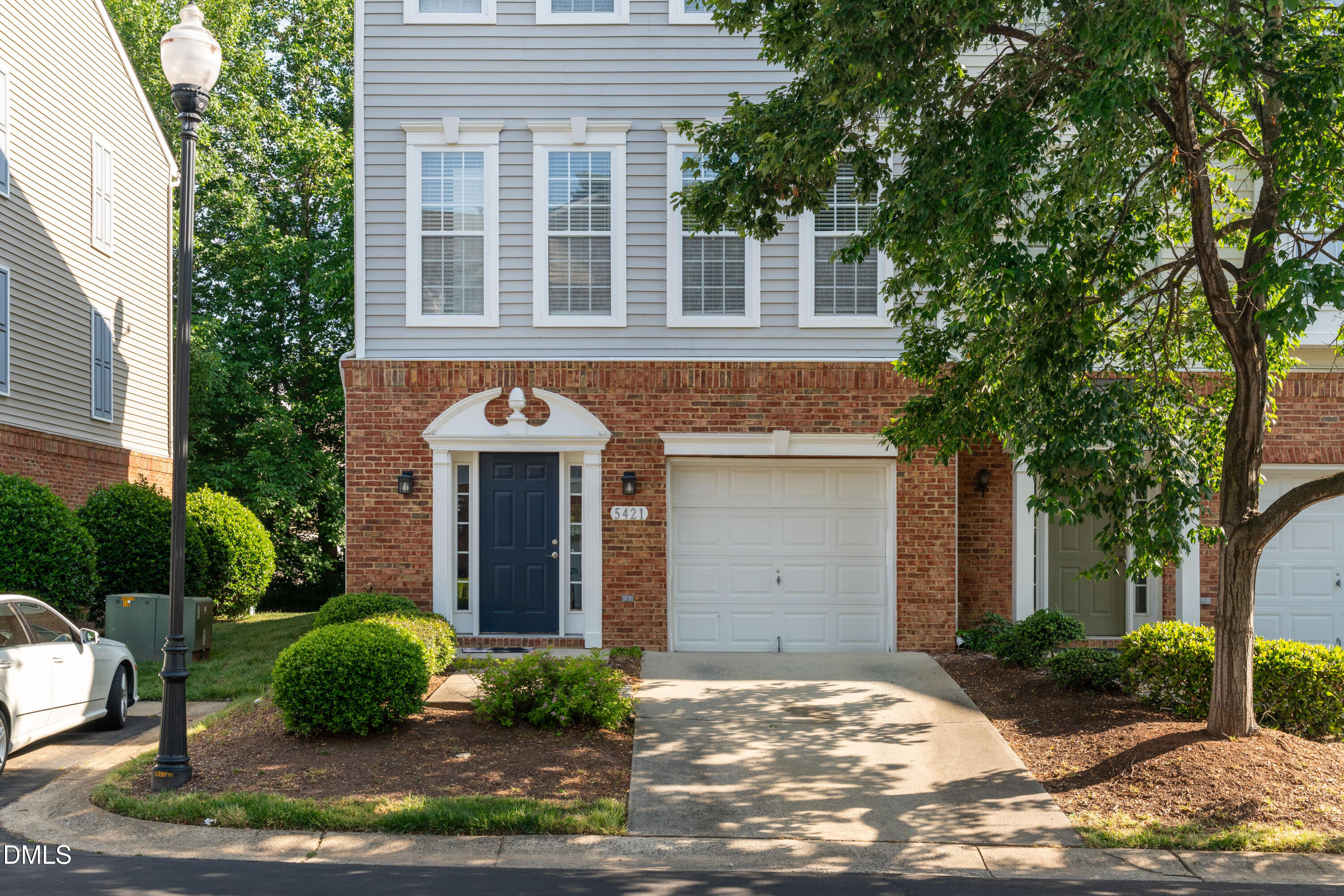 5421 Golden Arrow Lane Raleigh, NC 27613 - Photo 1 of 49 a front view of a house with garden