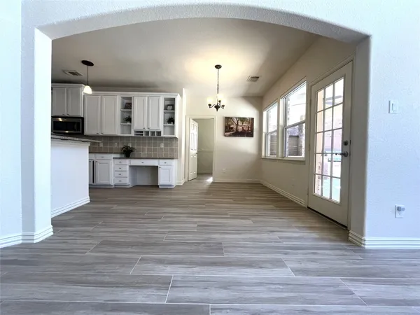 a view of kitchen and wooden floor