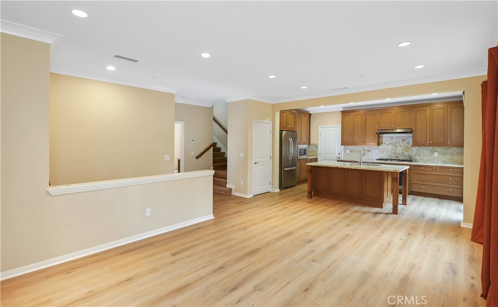 220 Kempton Irvine, CA 92620 - Photo 12 of 42 a large kitchen with a sink and a large window
