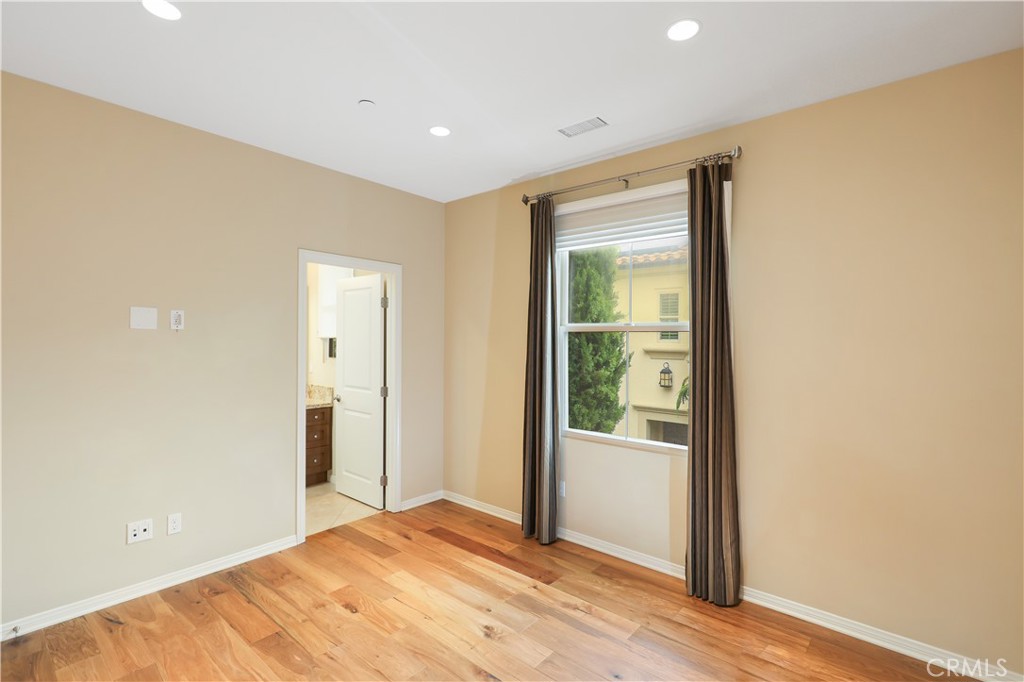 220 Kempton Irvine, CA 92620 - Photo 28 of 42 a view of a room with wooden floor and sliding glass door
