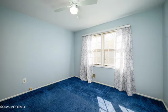 an empty room with closet area