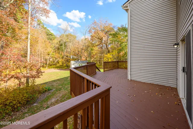 a view of a house with backyard and a slide