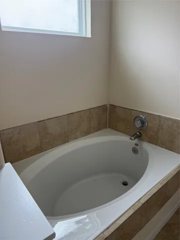 a bathroom with a bathtub