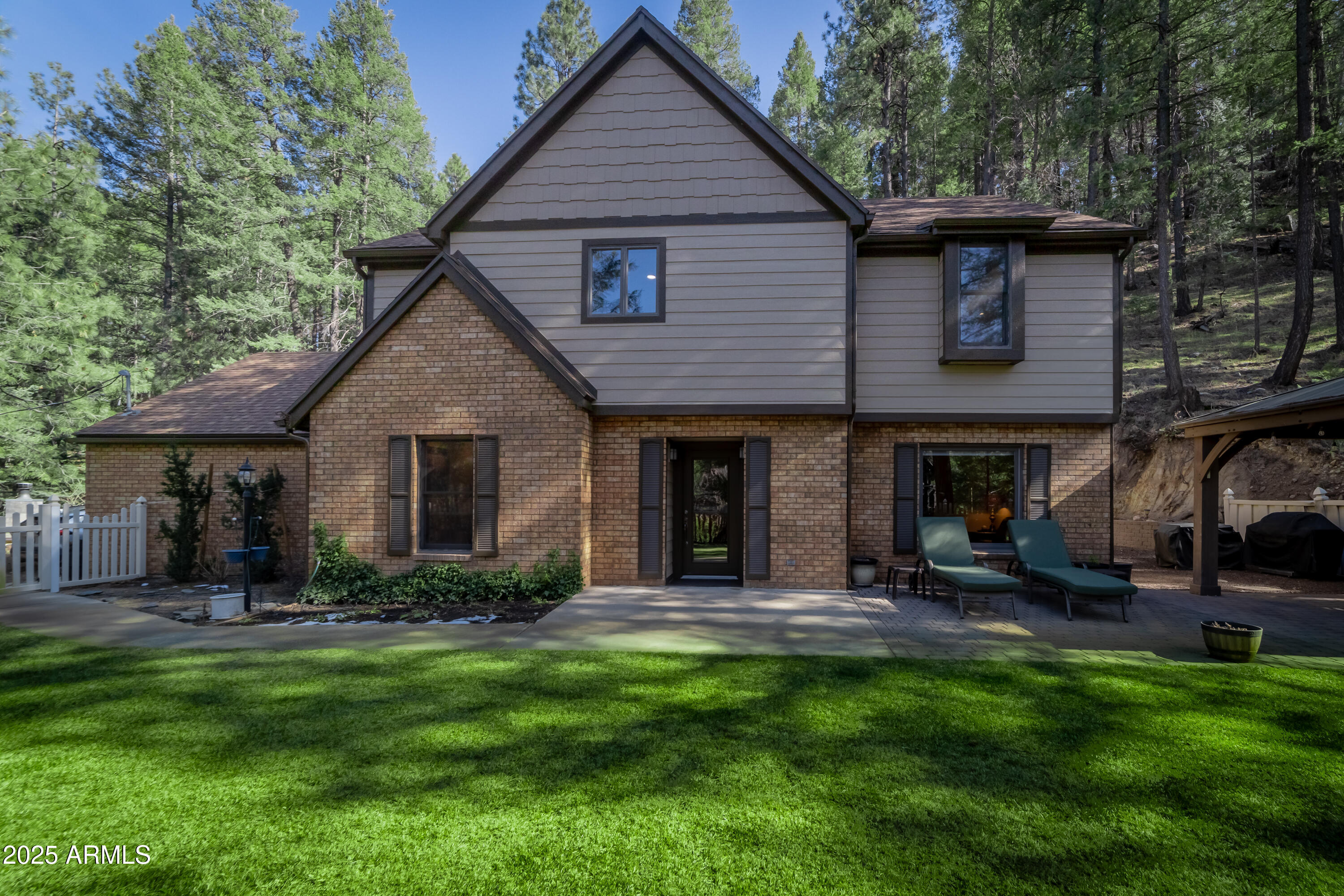 3929 East Sheldon Road Prescott, AZ 86303 - Photo 1 of 36 a front view of a house with a yard and outdoor seating