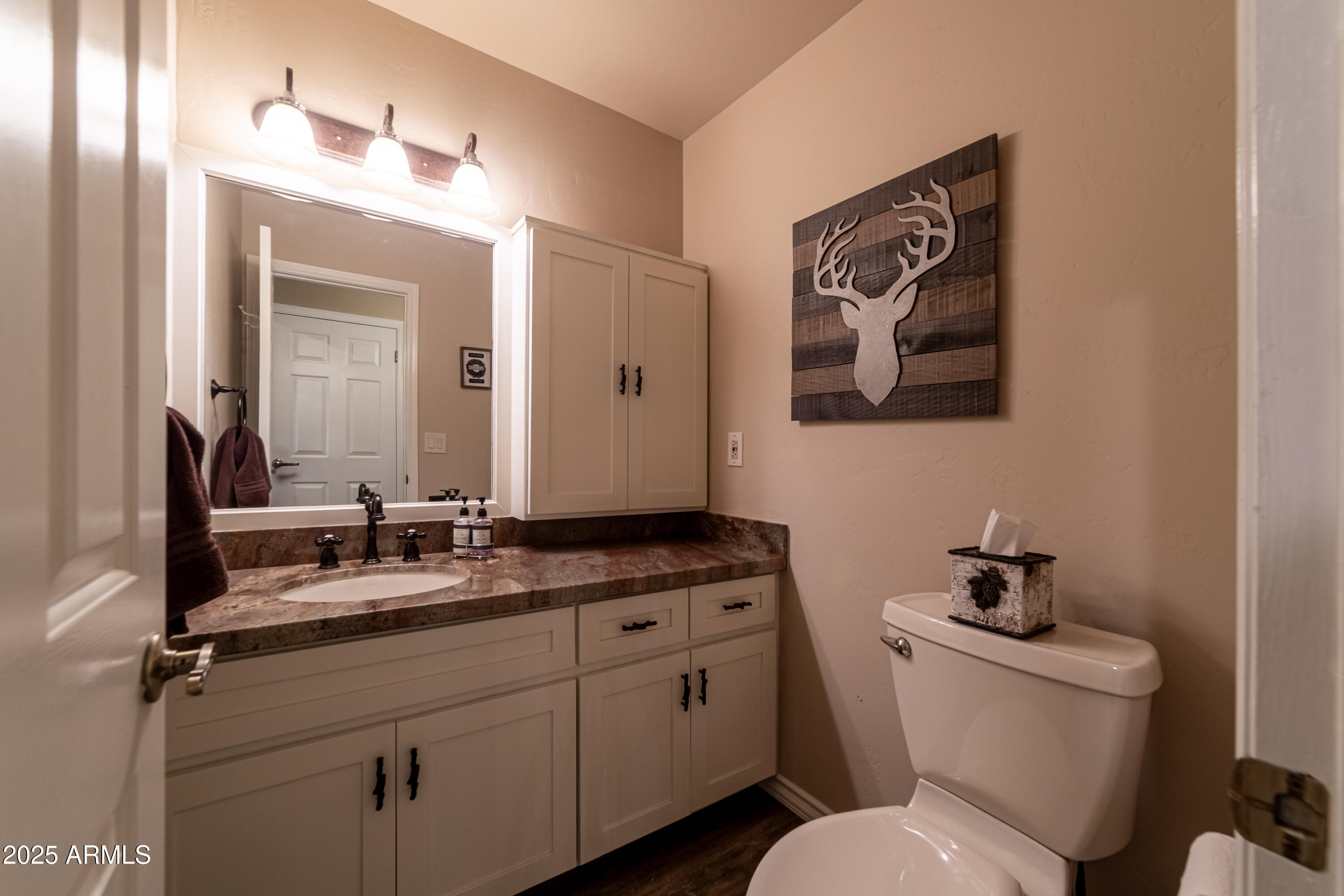 3929 East Sheldon Road Prescott, AZ 86303 - Photo 15 of 36 a bathroom with a toilet sink and mirror