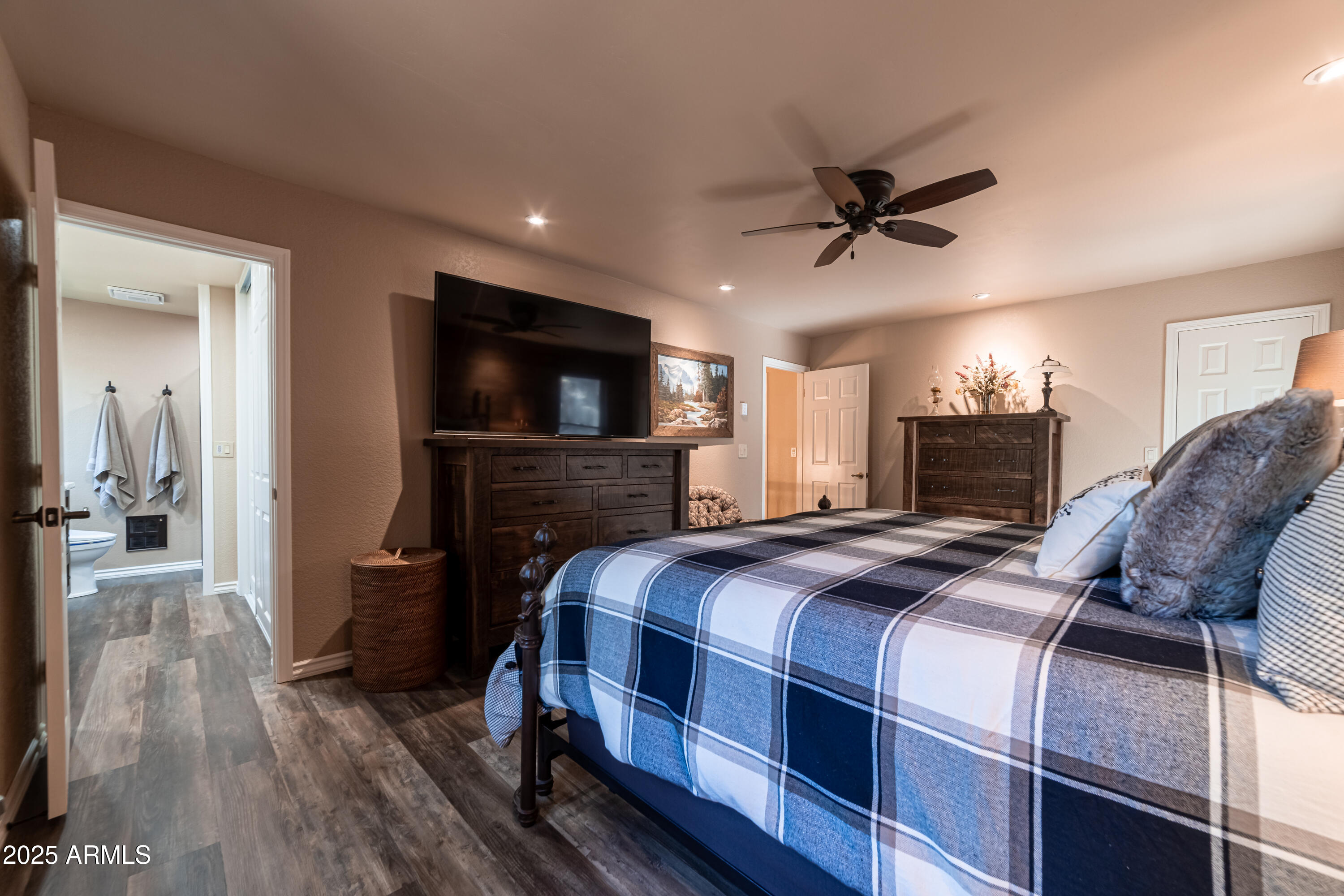 3929 East Sheldon Road Prescott, AZ 86303 - Photo 19 of 36 a bedroom with a bed and a flat screen tv